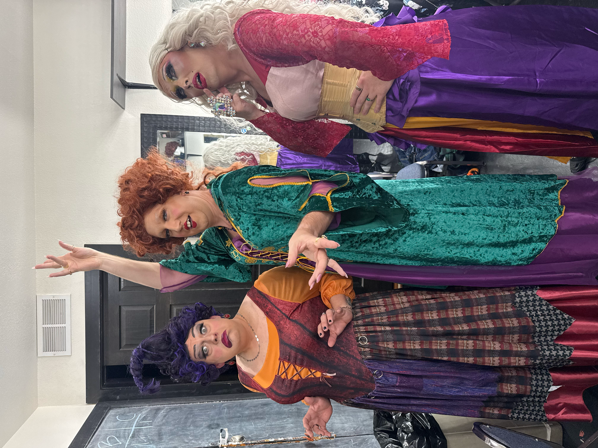 The three performers repeat their poses in full Sanderson Sisters costumes, wigs and makeup.