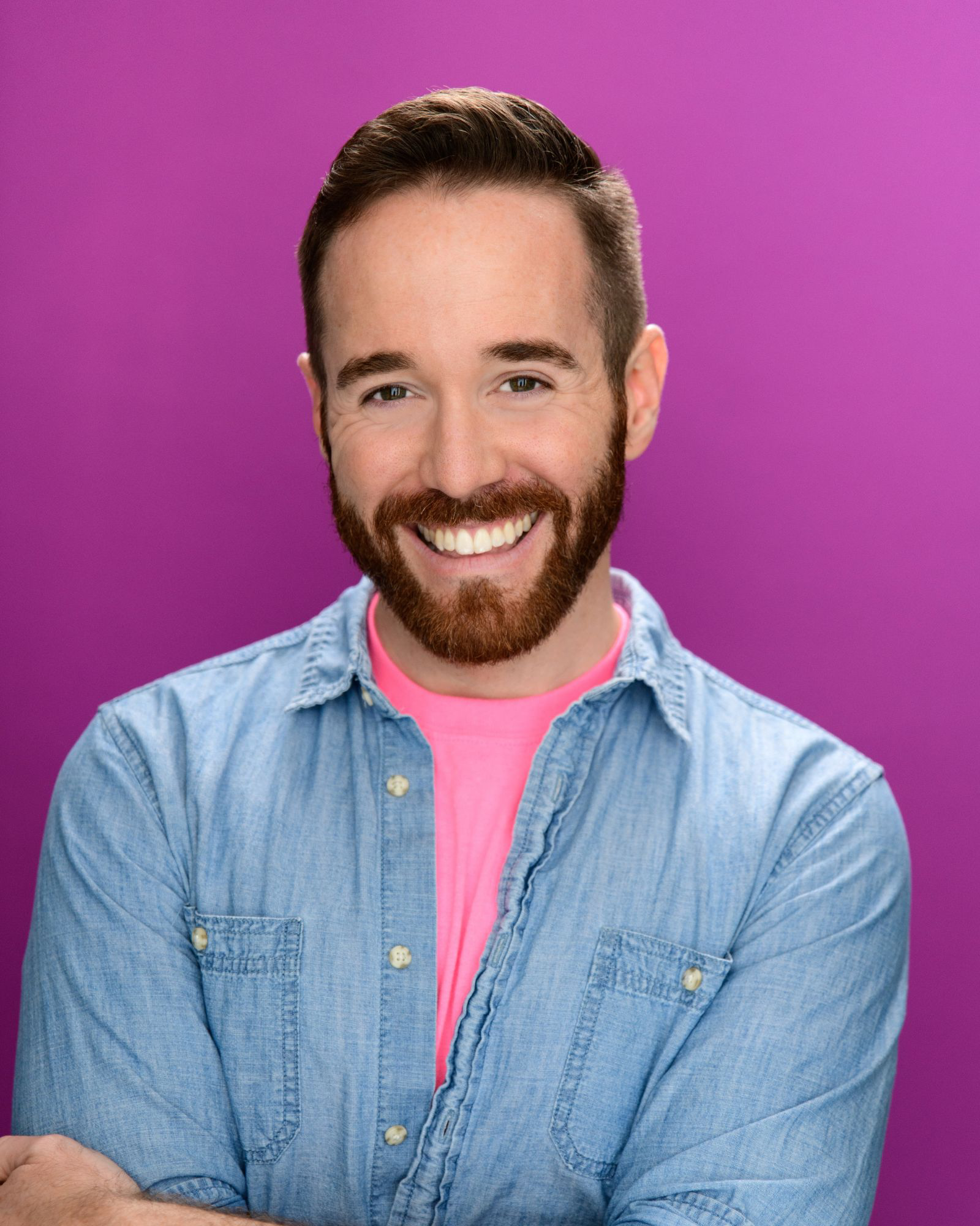 Doug Clemons, director of The Golden Girls, smiling against a pink background.